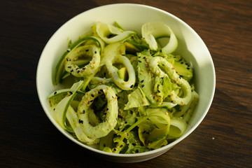 Fresh fried squid rings, marinated in sweet chili, healthy salad.