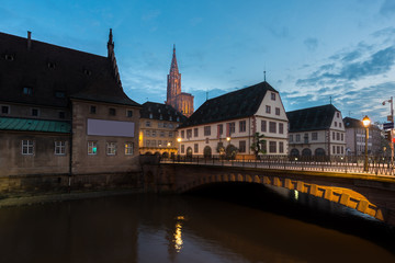 Fototapeta premium View of medieval bridge Ponts Couverts and Cathedral of Our Lady (Notre Dame) of Strasbourg at night in Strasbourg, France