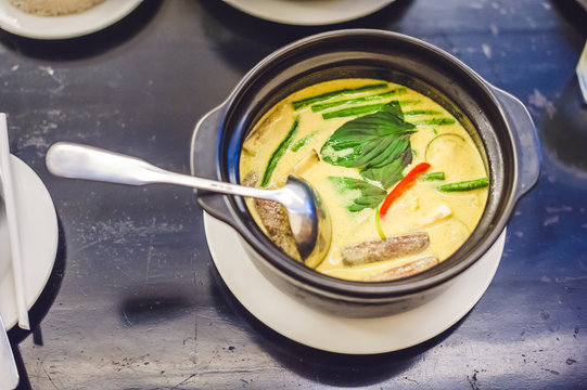 Thai food chicken green curry on dark wooden background. top view. Thai cuisine concept