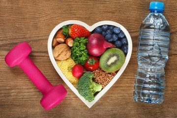 Healthy food in heart shaped bowl