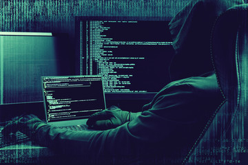 Internet crime concept. Hacker working on a code on dark digital background with digital interface...