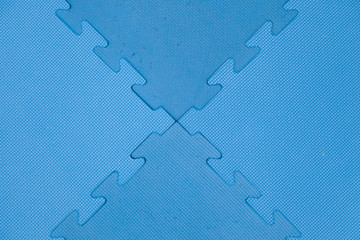 Blue protective rubber coating on children or sport playground.