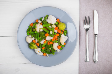 Delicious mix of vegetables on the plate. View from above. Close-up