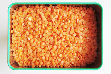 Red lentils in a tin box
