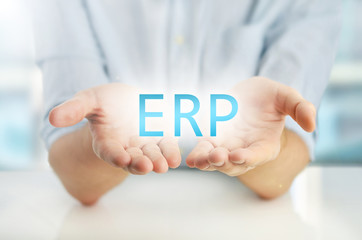 Man showing ERP cloud on his hands.