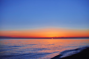 Sunset clouds in the sea 