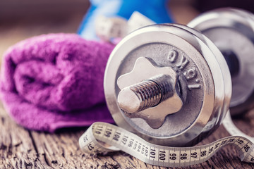 Fitness Equipment. Kettlebell  dumbbells towel water and measuring tape.