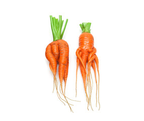 irregularly shaped carrots isolated on white background