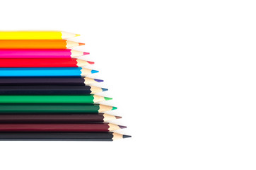 Colored pencils on white background