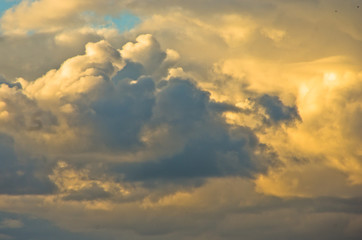 Colorful and picturesque golden clouds at sunset