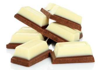 Broken chocolate bars on white background