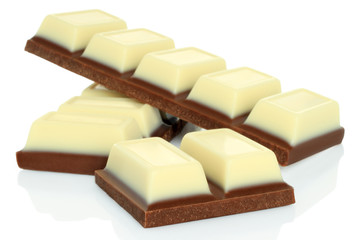 Broken chocolate bars on white background