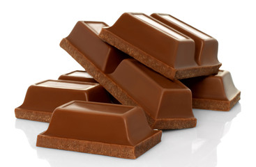 Broken chocolate bars on white background