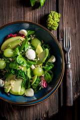 Spring kale salad with avocado, lettuce and grape