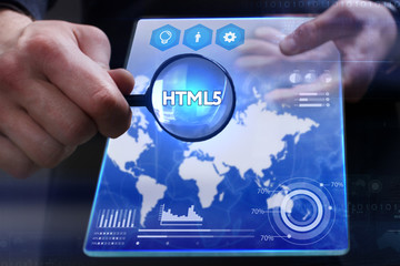 Business, Technology, Internet and network concept. Young businessman showing a word in a virtual tablet of the future: HTML5
