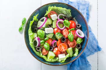 Spring Greek salad with lettuce, cherry tomatoes and feta cheese