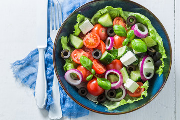 Fresh Greek salad with lettuce, cherry tomatoes and feta cheese