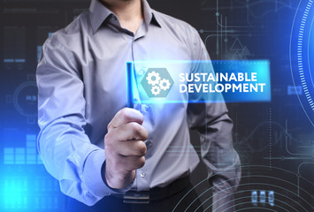 Business, Technology, Internet and network concept. Young businessman showing a word in a virtual tablet of the future: Sustainable development