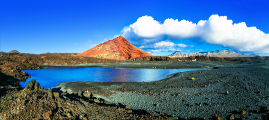 Unique volcanic nature of Lanzarote island with black sands and red mountains. Canary islands