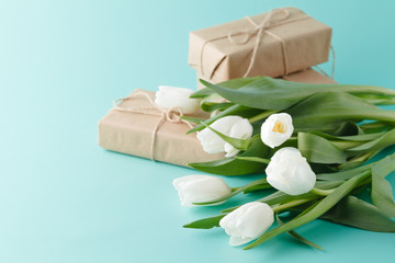 Obraz na płótnie Canvas Compliment gift with spring white tulips