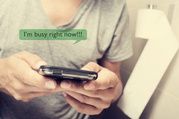 man in the toilet sending a message