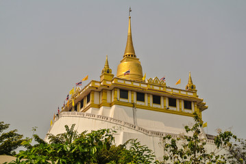 Phu Khao Thong or Golden mountain is a steep artificial hill inside Wat Saket in Bangkok Thailand