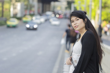 Asian beautiful girl tourists walking on the streets in Bangkok.