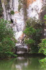 Fototapeta na wymiar Limestone rocks surrounded by the emerald lagoon
