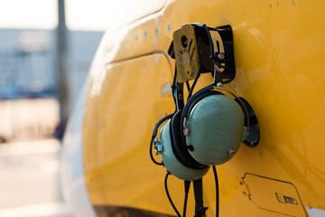 Aviation headset hanging on aircraft