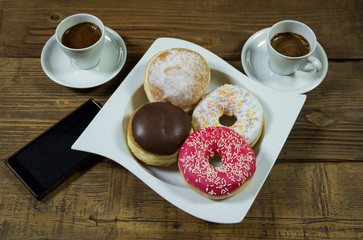 Delicious donuts with coffe
