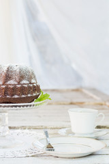 Ring shaped chocolate cake with white chocolate sauce
