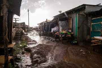 Fototapeta na wymiar African open air market while raining