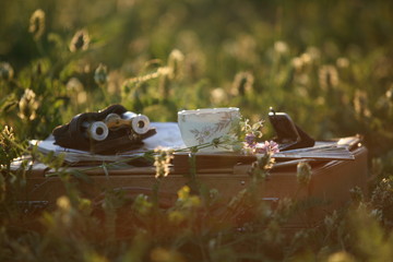 a cup of tea on the sunset light and pearl operaglasses