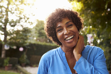 A Beautiful Happy Middle Aged African American Woman Relaxing And