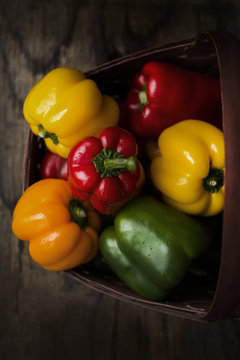Variety of fresh bell peppers in basket