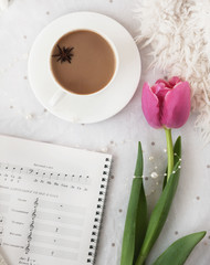 Spring flower and cup of hot coffee