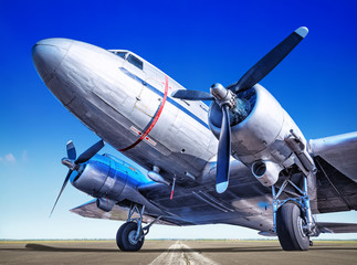 historic airplane on a runway