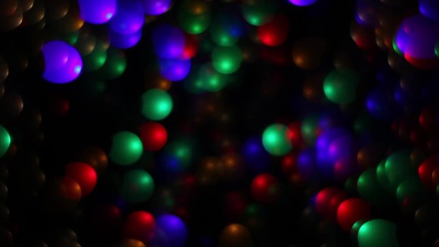 Abstract holiday background with fairy tale blinking lights in magic tunnel. Festive twinkling decoration with unusual defocus figures. Celebration in merry flashing colorful specks on dark night.
