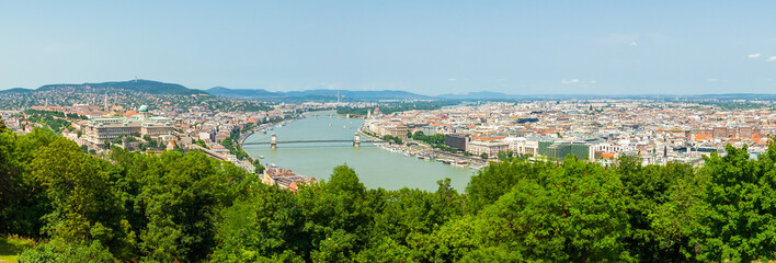 Fototapeta na wymiar Panoramic view of Dunabe river with bridge connecting Buda and Pest in Budapest, Hungary