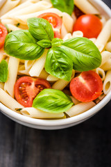 plate of penne pasta with tomato
