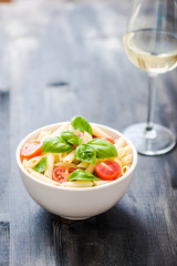 plate of penne pasta with tomato