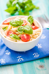 plate of penne pasta with tomato