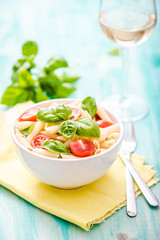 plate of penne pasta with tomato