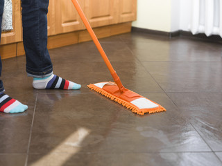 Woman Mopping Floor