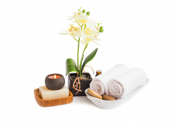 Spa set isolated .Orchid flower with towels, soap and candle burning on white background