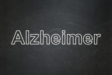 Health concept: Alzheimer on chalkboard background