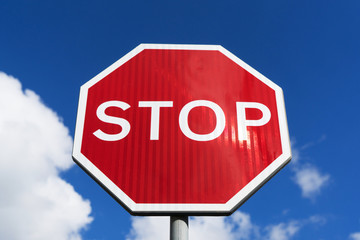 Stop sign blue sky background. Traffic signs.