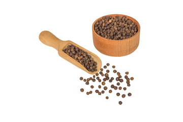 allspice in a small wooden scoops. Black pepper. Spice. isolated on white background.