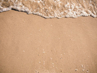 Beautiful sand background and wave from sea. Sand Texture background.