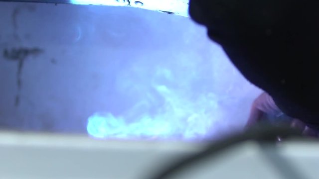 Smoke and sparks from iron cutting